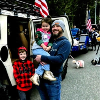 Chiropractor Scott Folsom Smiling With Kids
